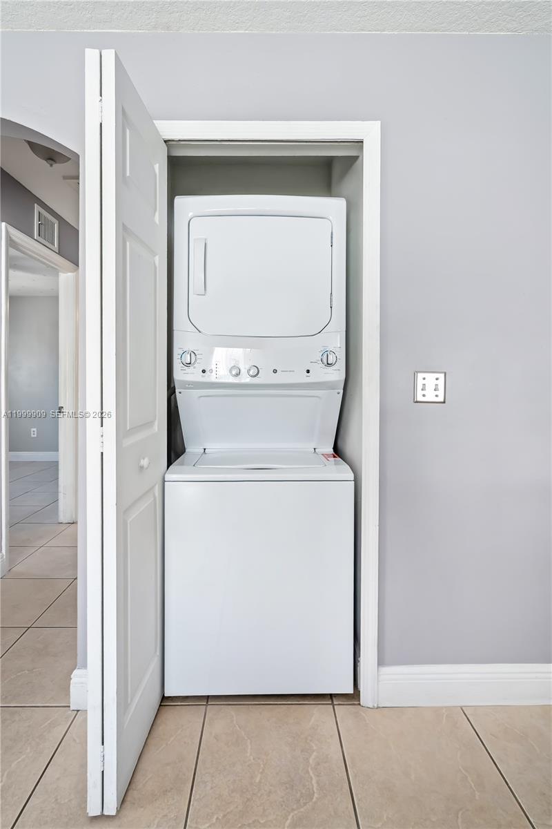 760 Northwest 80th Street, Unit 760 Miami, FL 33150 - Photo 10 of 32 a utility room with dryer and washer
