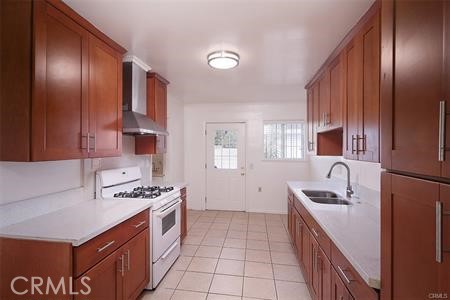 1235 West San Bernardino Road Covina, CA 91722 - Photo 13 of 27 a kitchen with stainless steel appliances granite countertop a sink stove and refrigerator