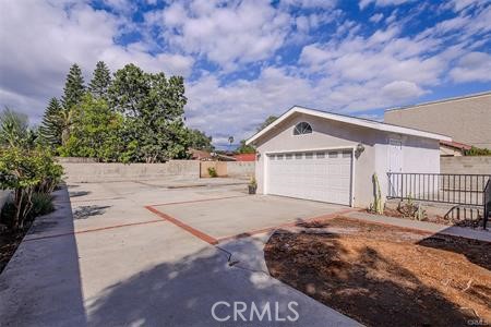 1235 West San Bernardino Road Covina, CA 91722 - Photo 19 of 27 a front view of a house with a yard and garage