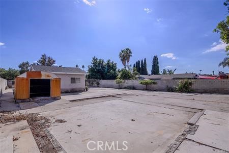 1235 West San Bernardino Road Covina, CA 91722 - Photo 22 of 27 a view of a house with a yard and a garage
