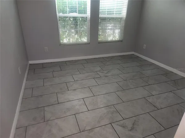 an empty room with windows