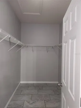 a view of an empty walk in closet