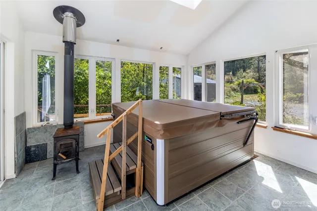 a view of a house with backyard and deck