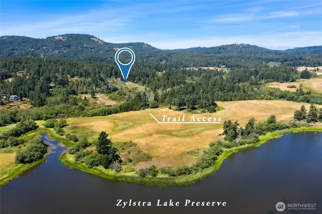 a view of a town with mountains in the background
