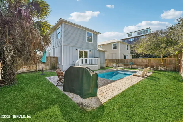 a view of a chair and tables in the patio