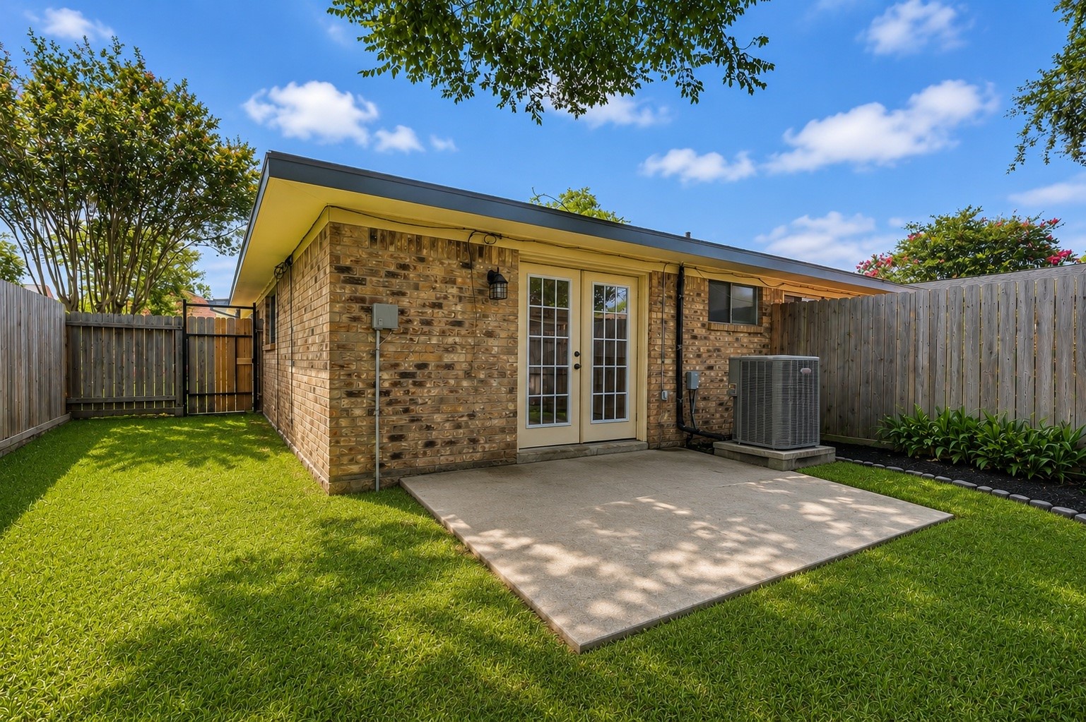 1447 Silverpines Road Houston, TX 77062 - Photo 17 of 17 Cozy fenced backyard provides privacy, and includes a small patio area. It's a quaint outdoor space for relaxation or entertaining.