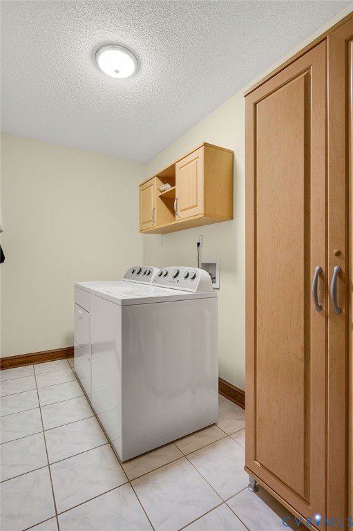 6724 Claiborne Road Sutherland, VA 23885 - Photo 16 of 33 Laundry room with cabinet space, a textured ceilin