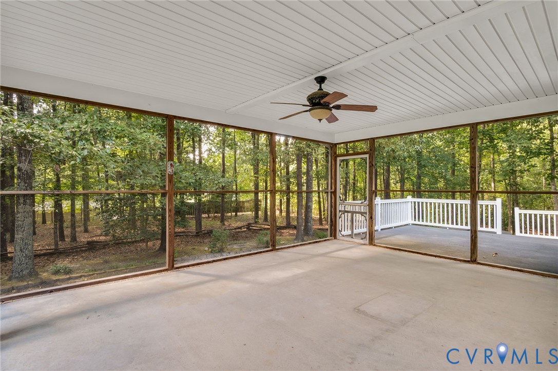 6724 Claiborne Road Sutherland, VA 23885 - Photo 24 of 33 Unfurnished sunroom featuring ceiling fan