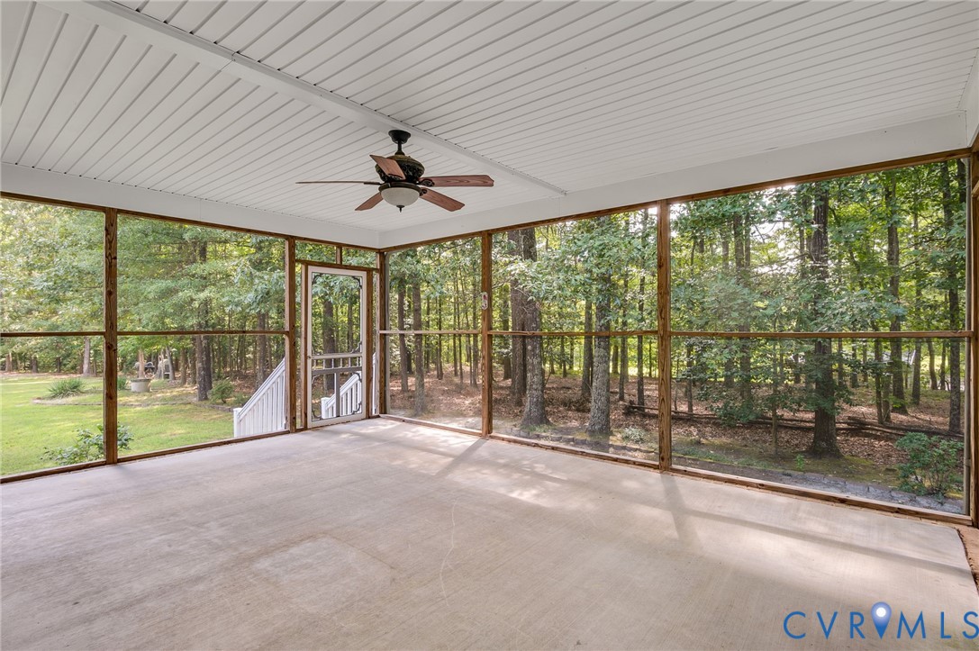 6724 Claiborne Road Sutherland, VA 23885 - Photo 25 of 33 Unfurnished sunroom with ceiling fan and healthy a