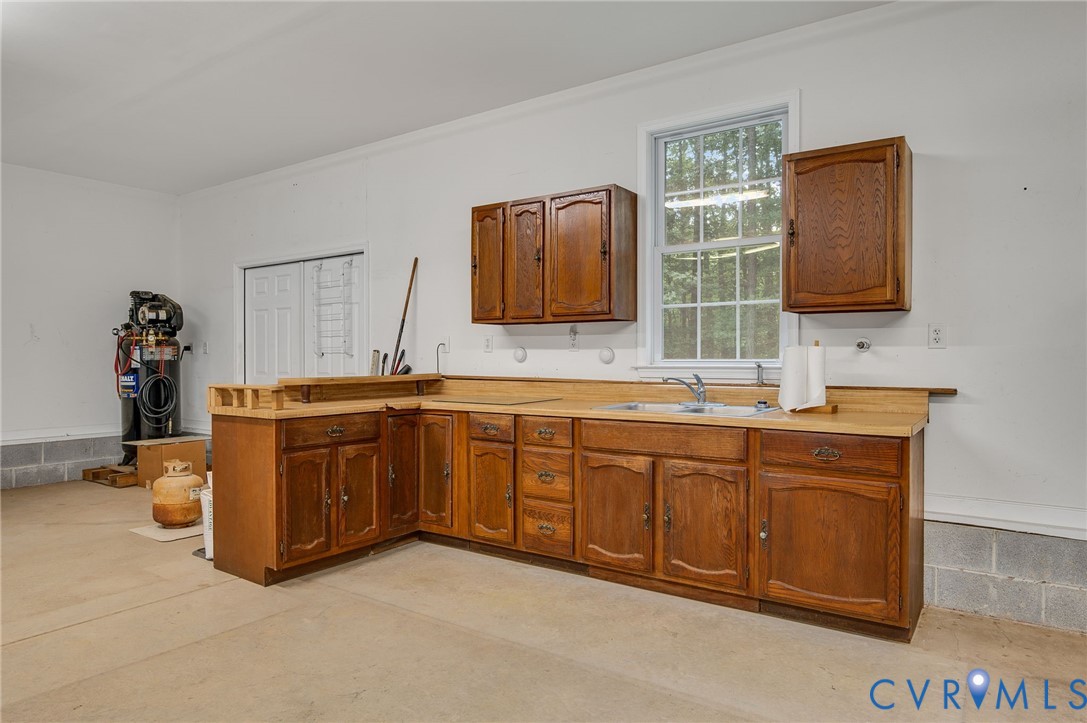 6724 Claiborne Road Sutherland, VA 23885 - Photo 32 of 33 Kitchen featuring a peninsula, light countertops,