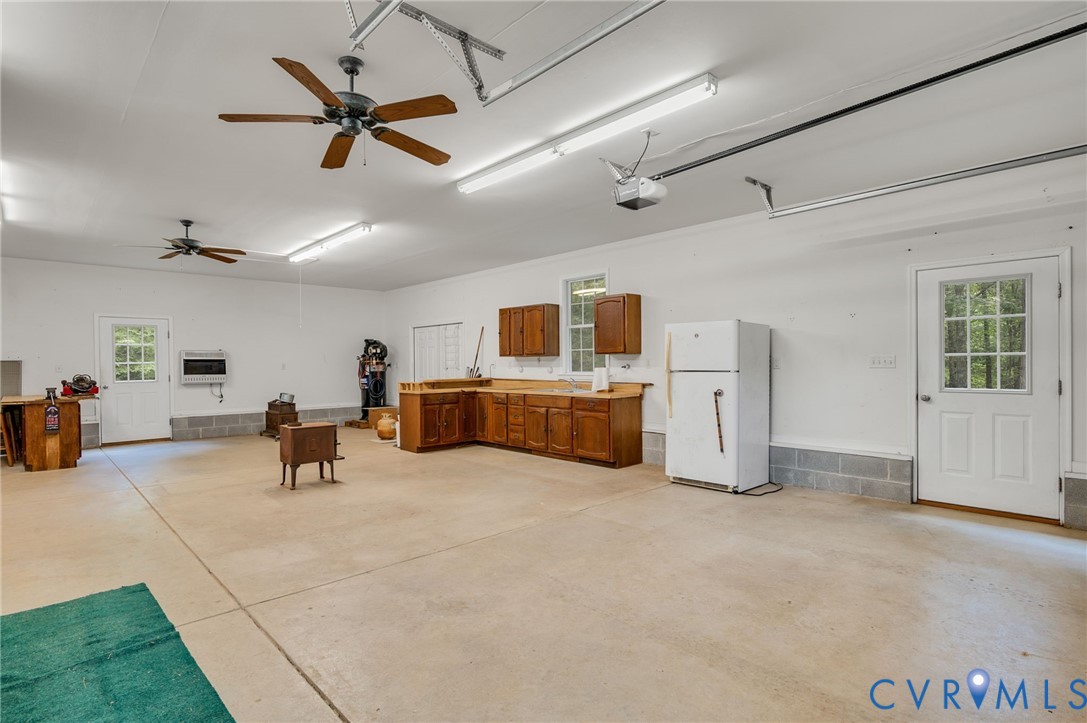 6724 Claiborne Road Sutherland, VA 23885 - Photo 33 of 33 Garage featuring freestanding refrigerator, heatin