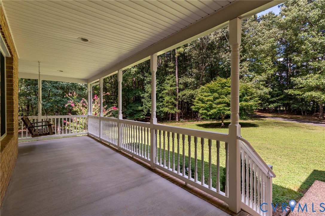 6724 Claiborne Road Sutherland, VA 23885 - Photo 4 of 33 Covered porch featuring a yard and view of scatter