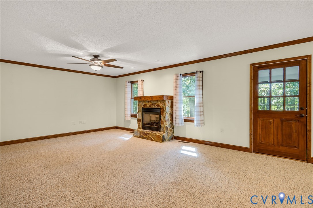 6724 Claiborne Road Sutherland, VA 23885 - Photo 10 of 33 Unfurnished living room featuring carpet flooring,