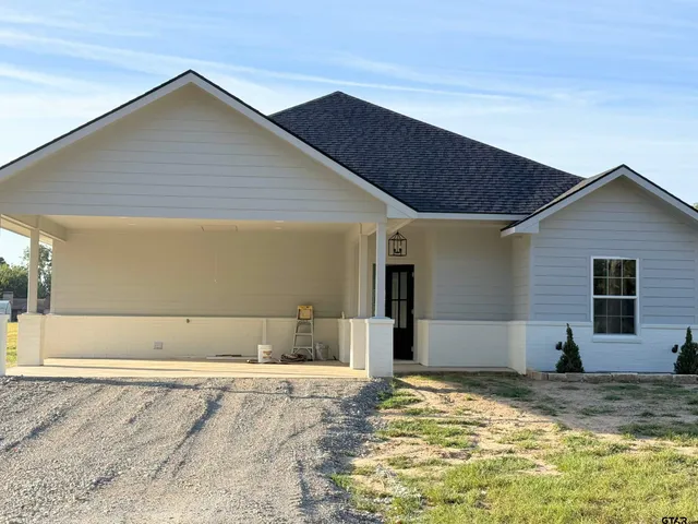 a view of a backyard of a house
