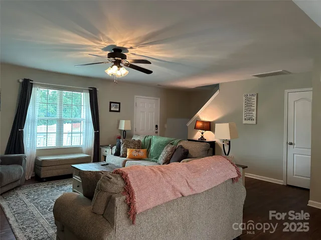 a bedroom with a bed couch and window
