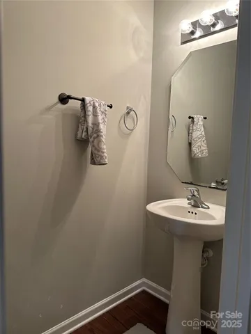 a bathroom with a sink and mirror