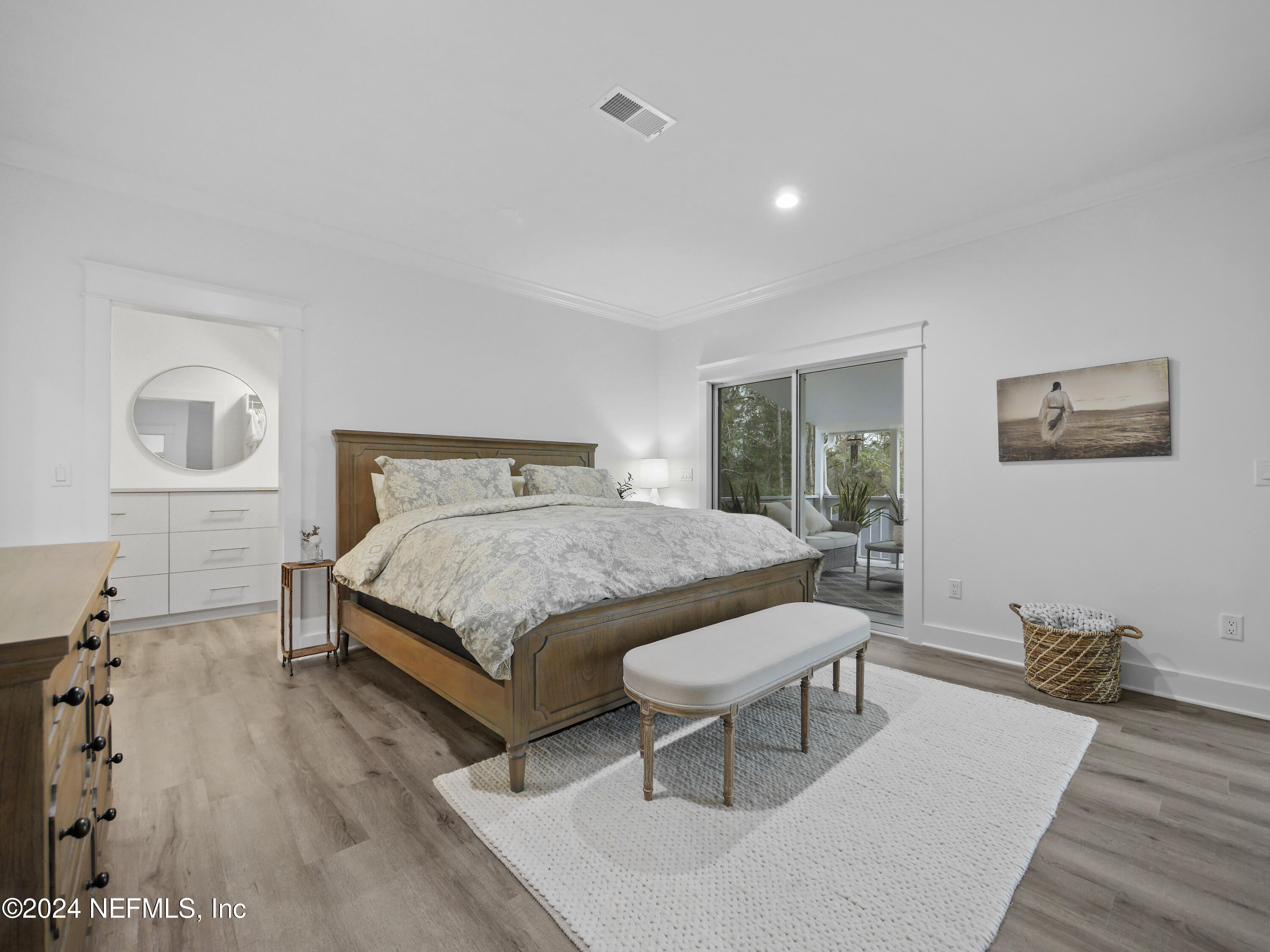 1837 Lake Road Jacksonville, FL 32226 - Photo 54 of 74 a bedroom with a bed and wooden floor