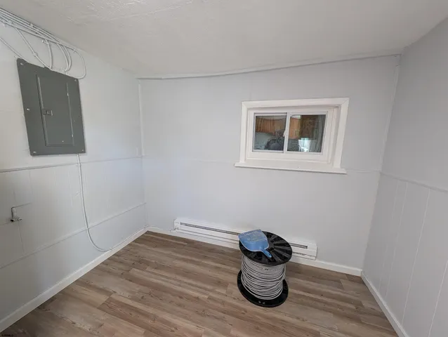 a room with chair and a window