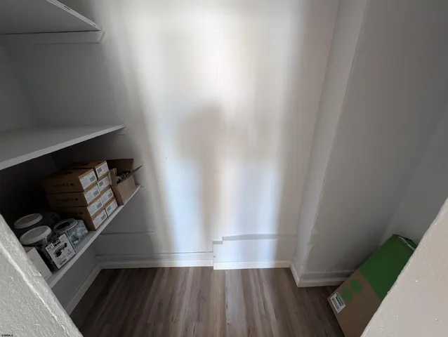 a view of entryway with wooden floor