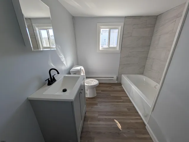 a bathroom with a sink and toilet
