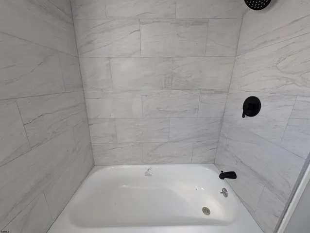 a bathroom with a bathtub
