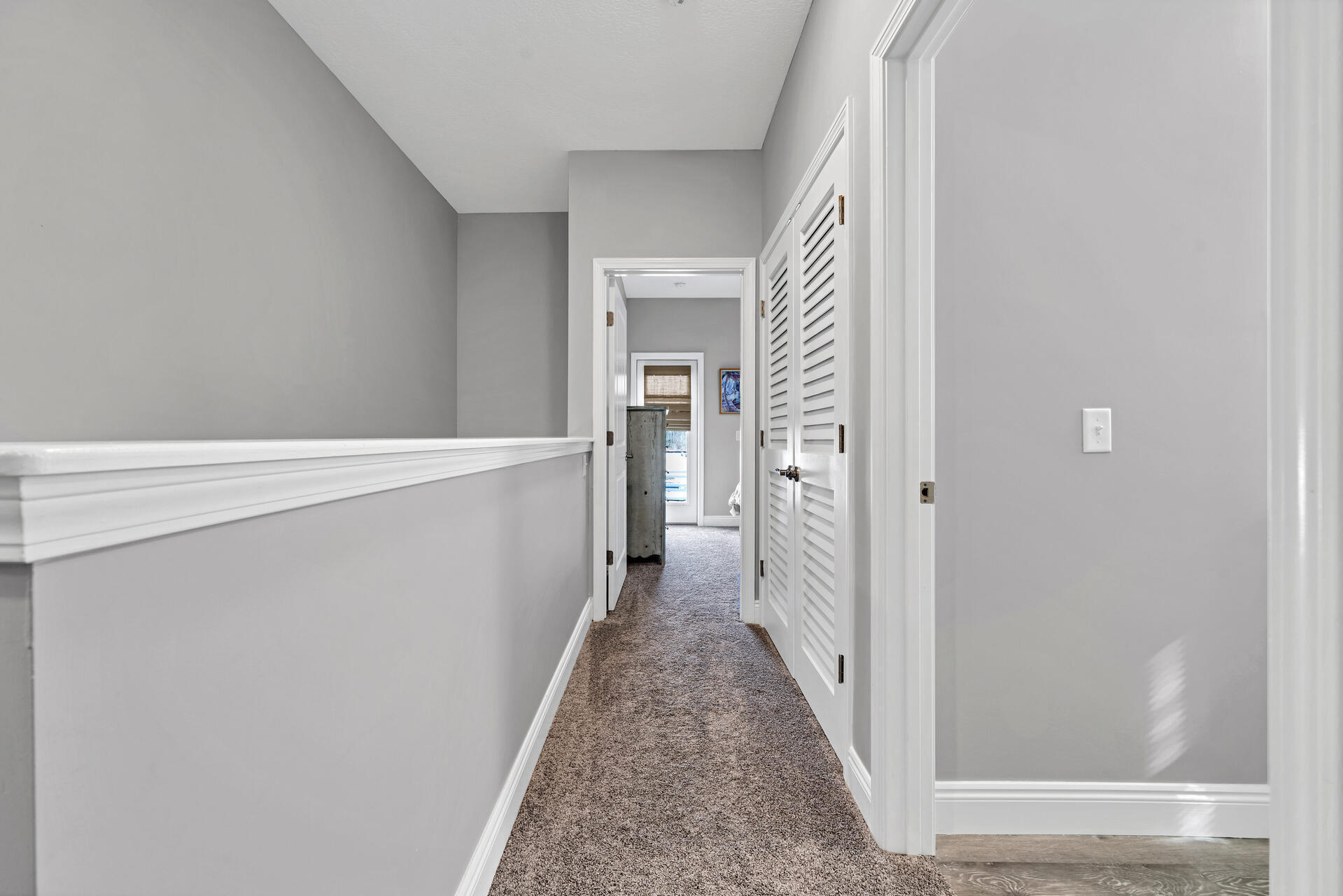 285 Indian Woman Road Santa Rosa Beach, FL 32459 - Photo 29 of 39 a view of a hallway with wooden floor