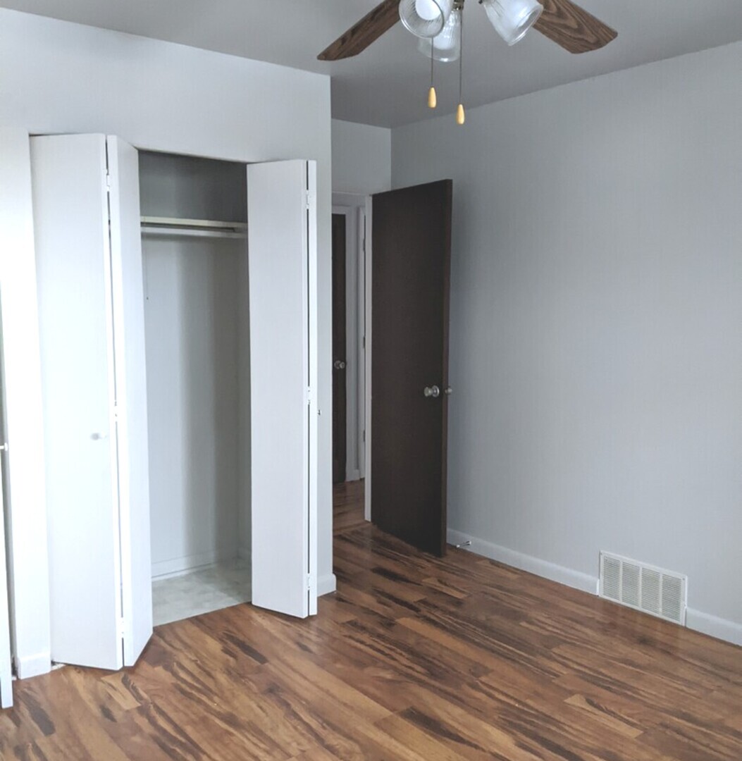 423 Grand Boulevard, Unit 423 Wauconda, IL 60084 - Photo 11 of 14 a view of hallway with wooden floor