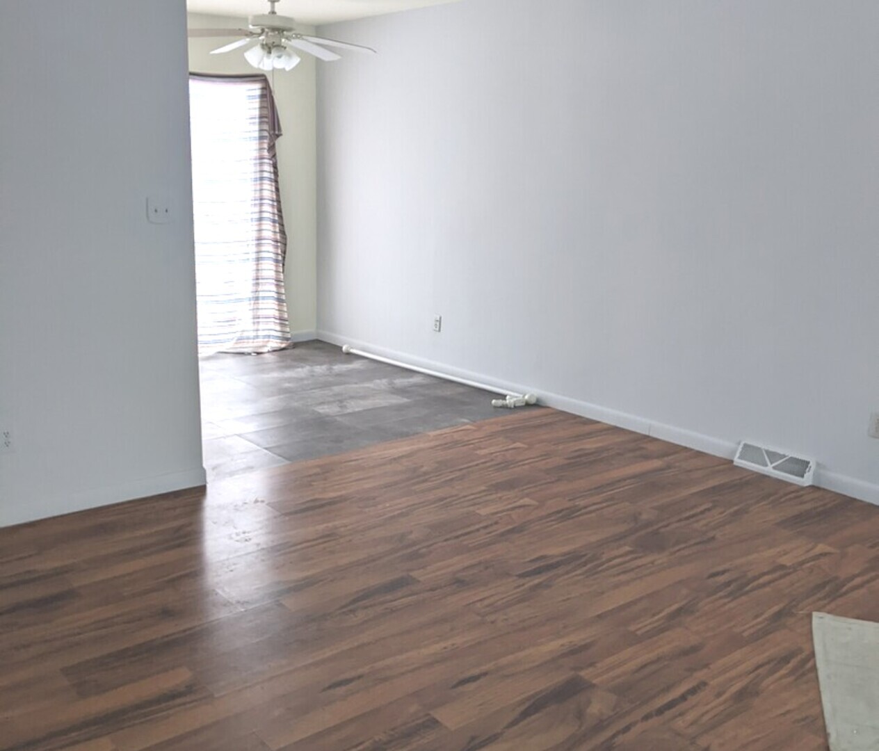 423 Grand Boulevard, Unit 423 Wauconda, IL 60084 - Photo 10 of 14 an empty room with wooden floor and windows