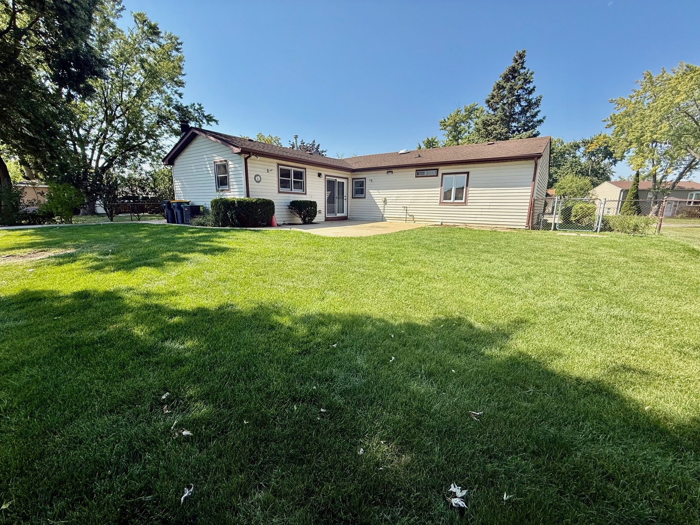 707 Sunset Circle Streamwood, IL 60107 - Photo 16 of 17 a front view of a house with a garden