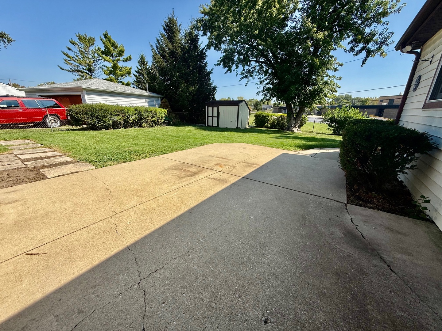 707 Sunset Circle Streamwood, IL 60107 - Photo 17 of 17 a front view of a house with a yard and garage