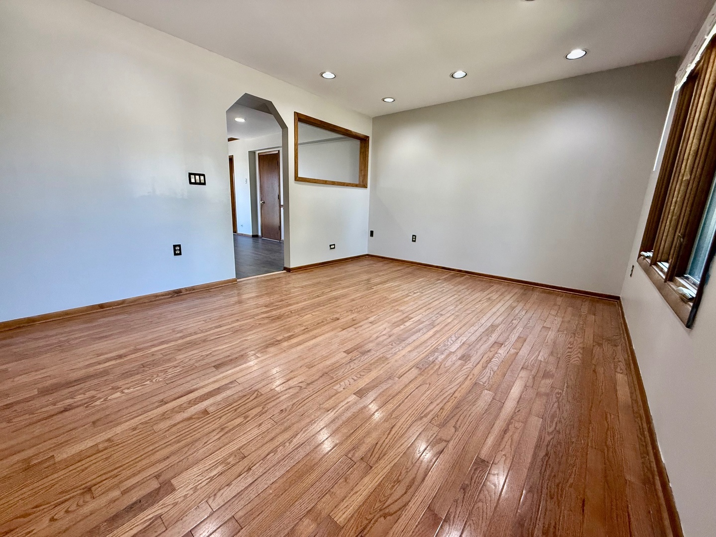 707 Sunset Circle Streamwood, IL 60107 - Photo 2 of 17 wooden floor in an empty room with a window