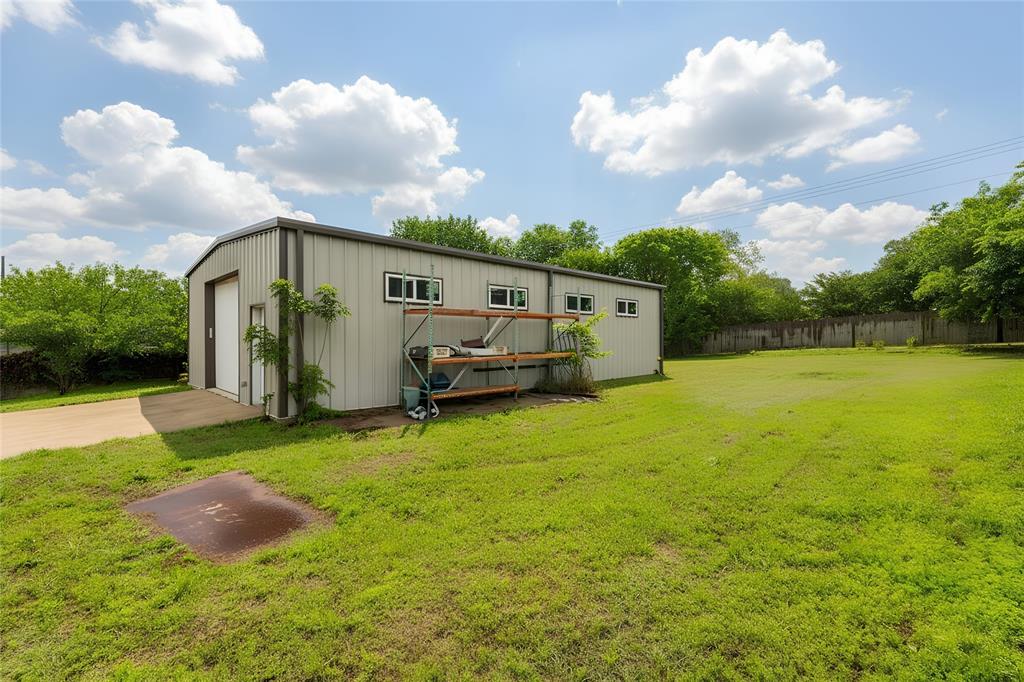 405 Kimbrough Road Azle, TX 76020 - Photo 37 of 39 a view of a garden with an house and wooden fence