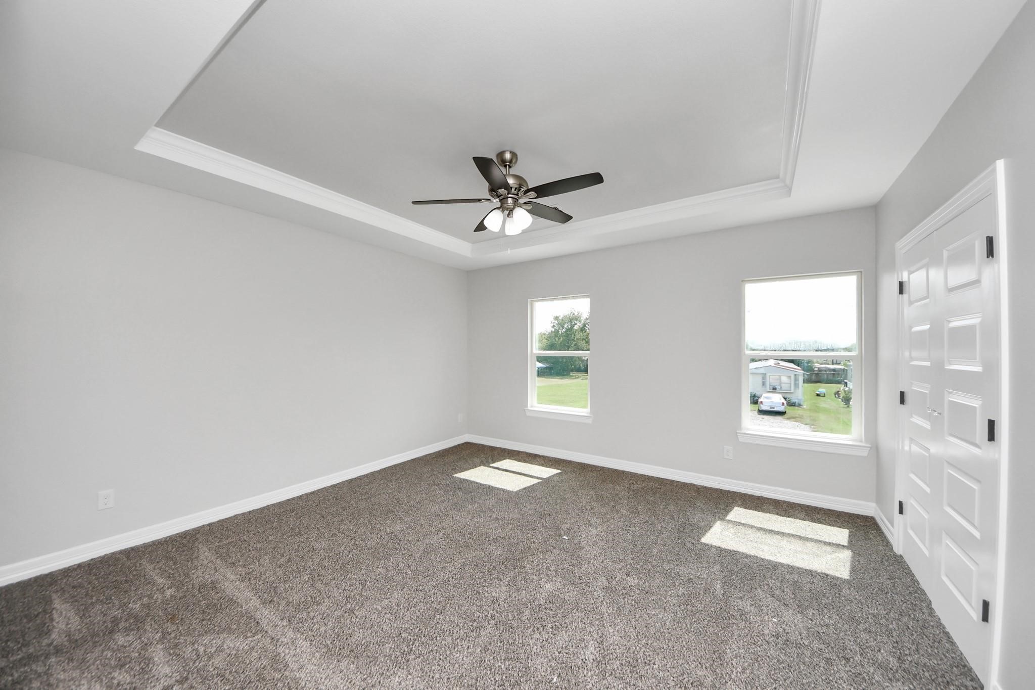 418 North 4th Street Beasley, TX 77417 - Photo 17 of 29 an empty room with windows and ceiling fan