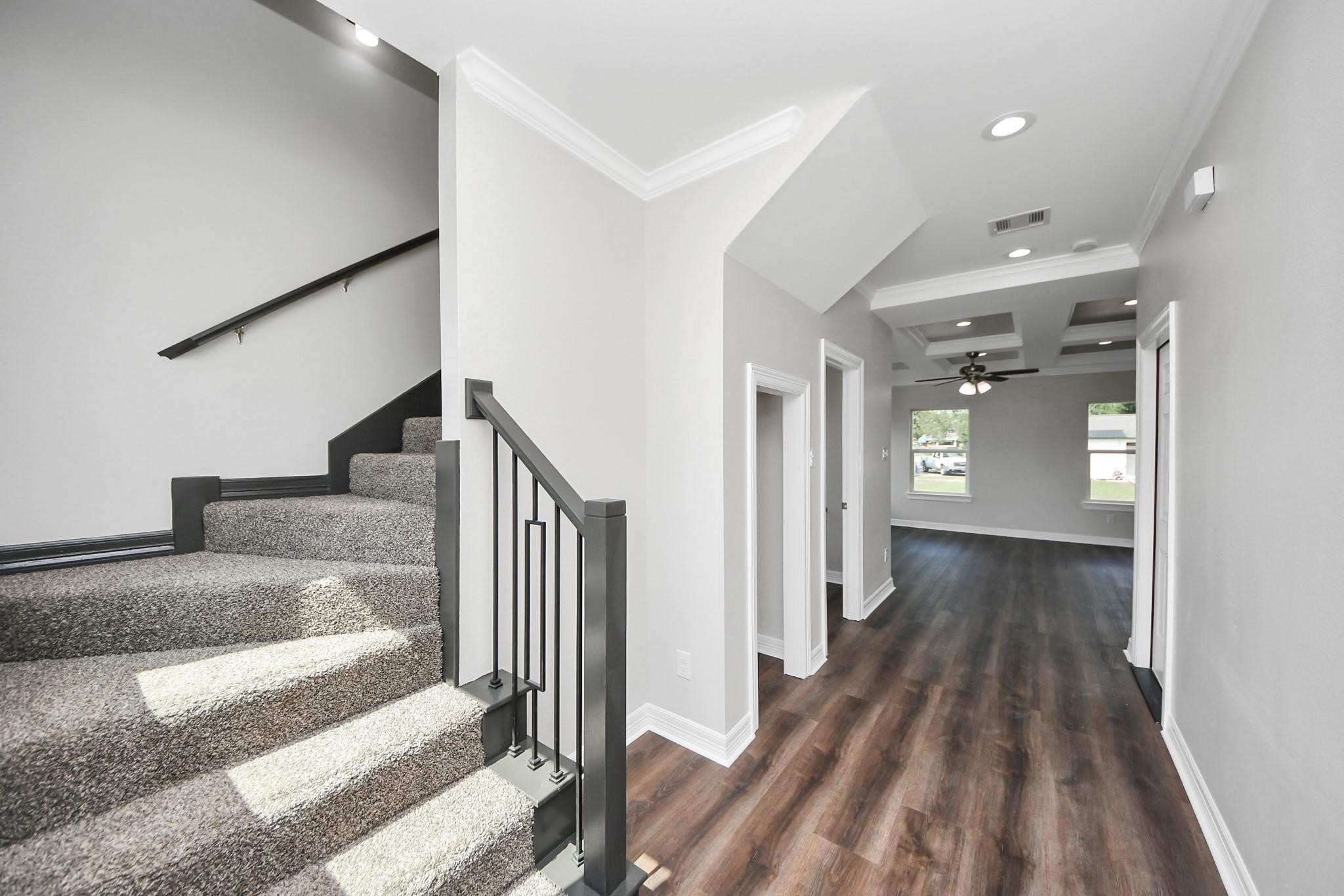 418 North 4th Street Beasley, TX 77417 - Photo 4 of 29 a view of a hallway with wooden floor and staircase