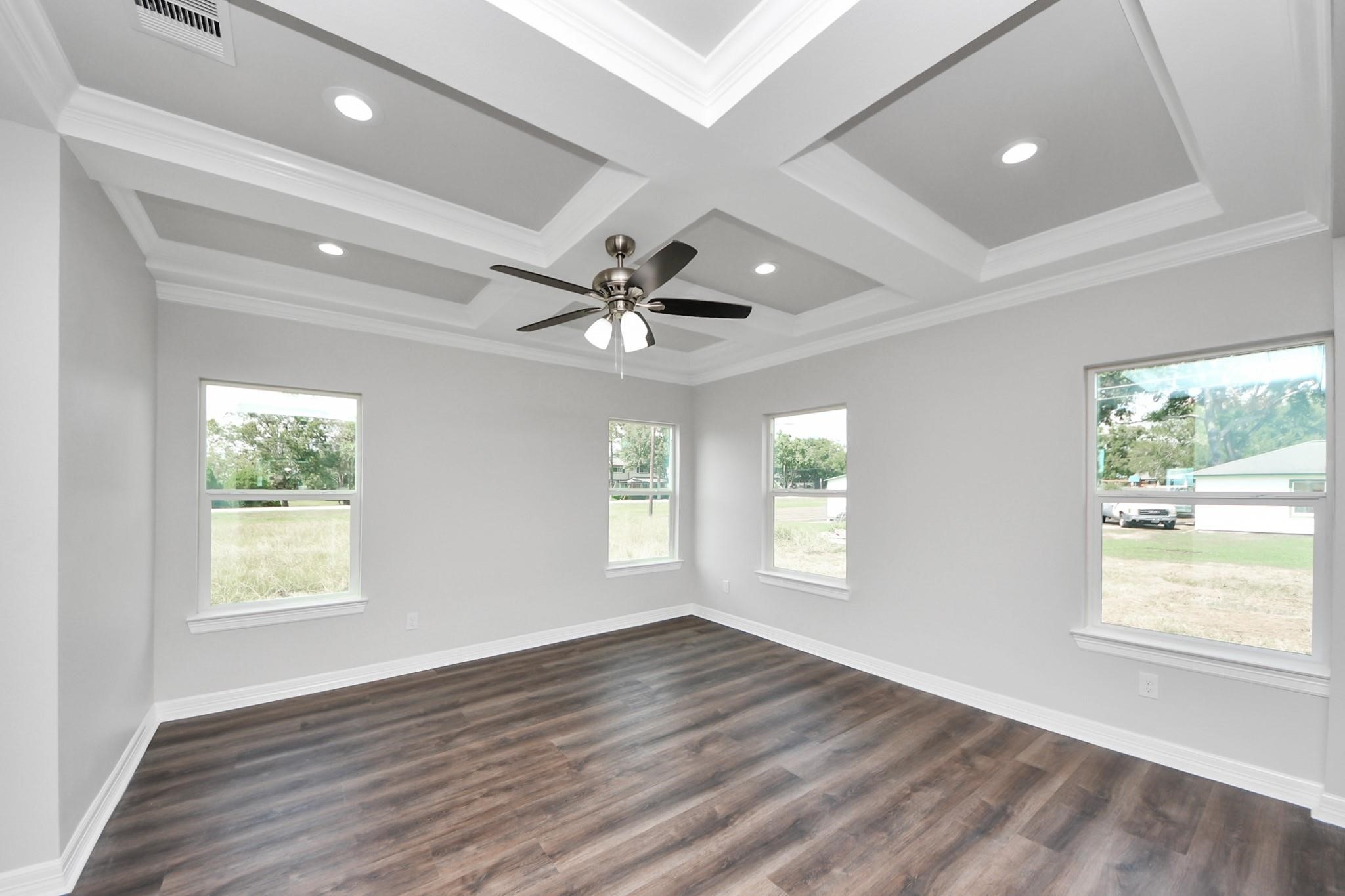 418 North 4th Street Beasley, TX 77417 - Photo 5 of 29 a view of an empty room with wooden floor and a window