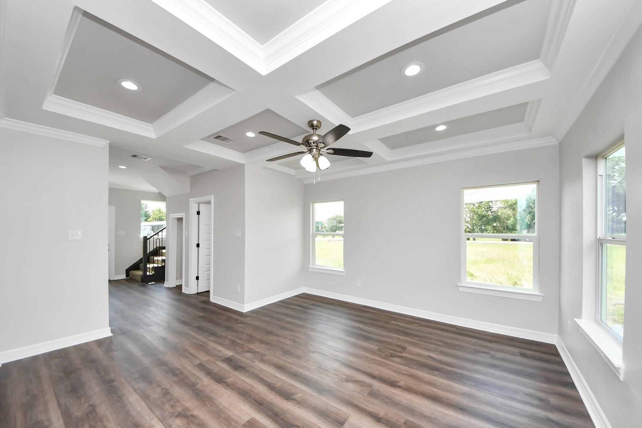 418 North 4th Street Beasley, TX 77417 - Photo 6 of 29 a view of an empty room with a window and wooden floor