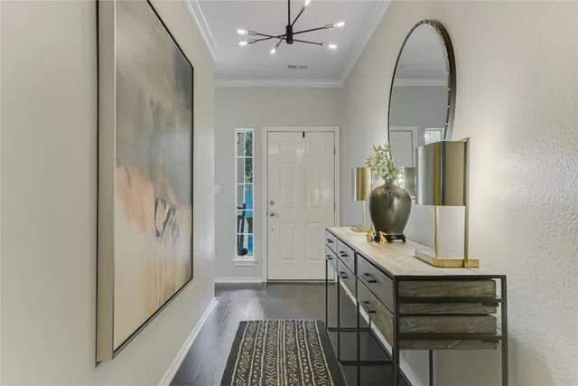 a view of room with sink and mirror with wooden floor