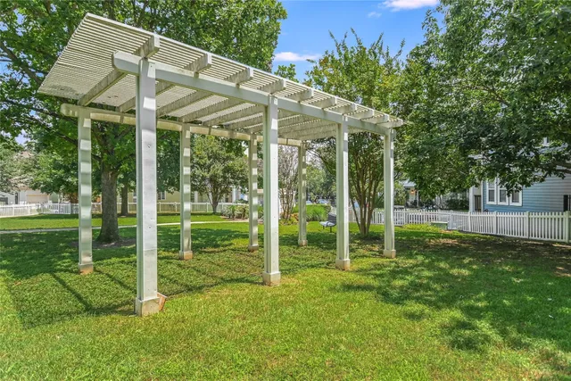 a view of a house with a garden and plants