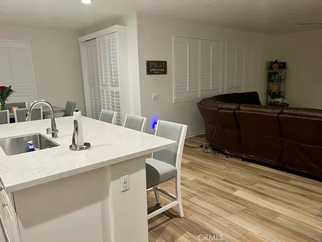 a kitchen with a table chairs and a sink