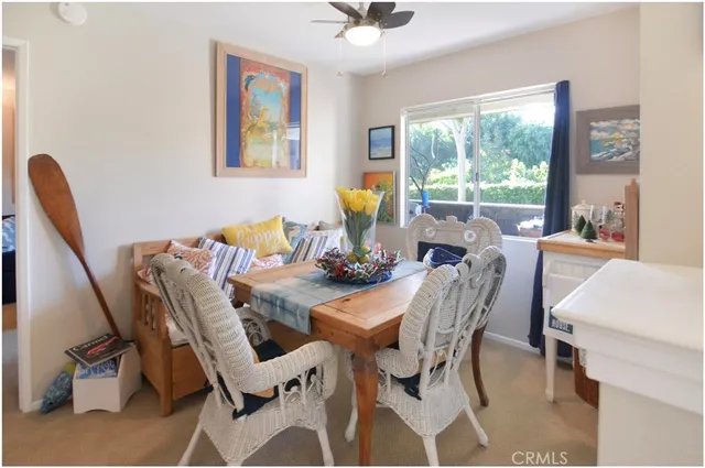 a dining room with furniture and window