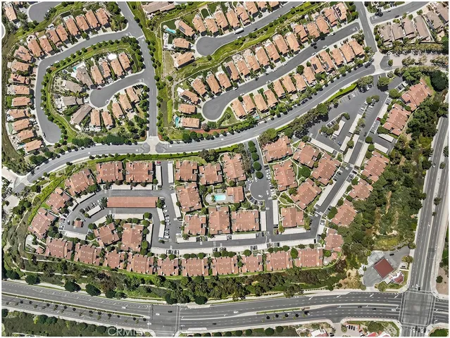 an aerial view of residential building and ocean view
