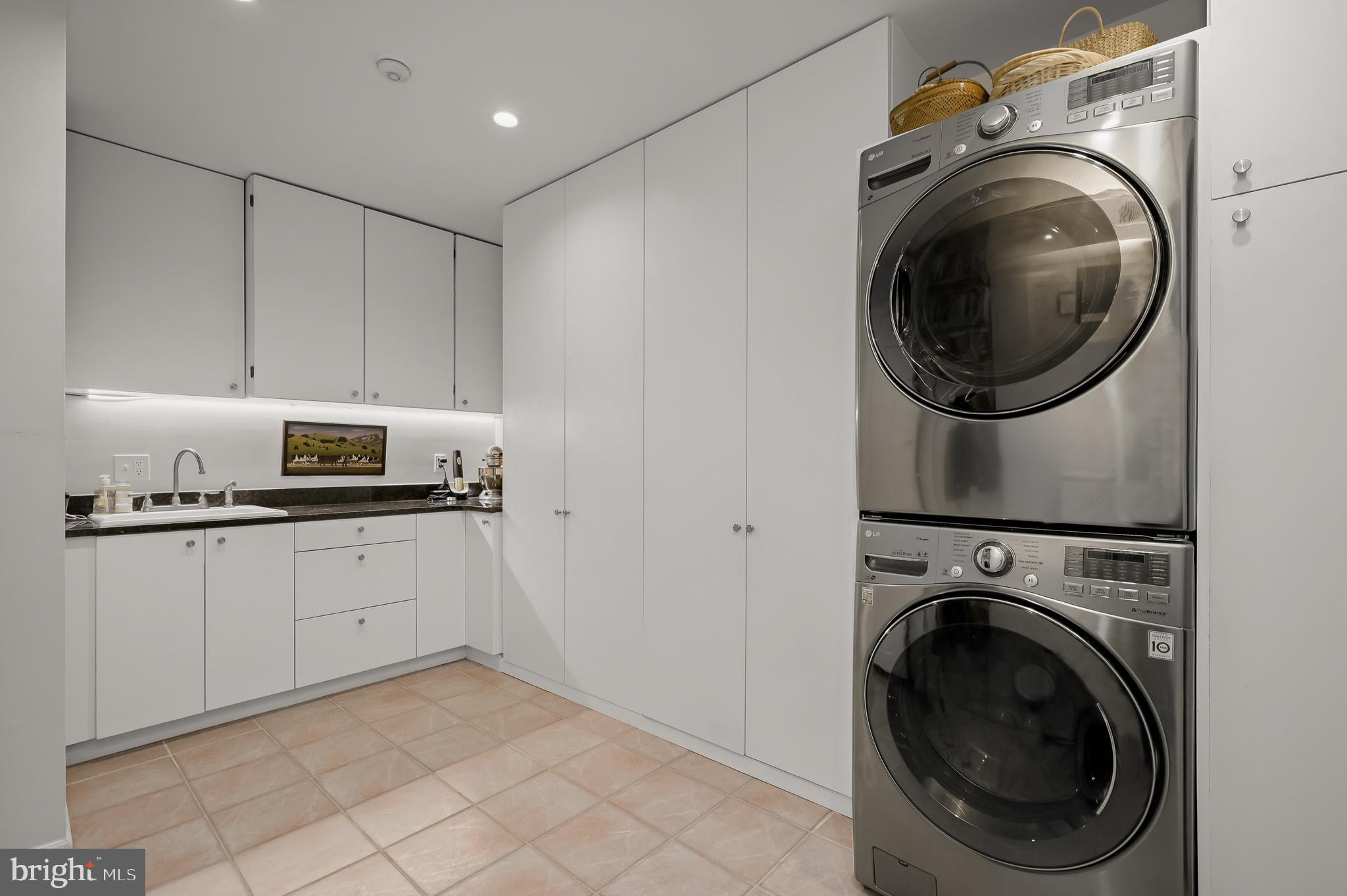 3224 Volta Place Northwest Washington, DC 20007 - Photo 17 of 35 a utility room with sink dryer and washer