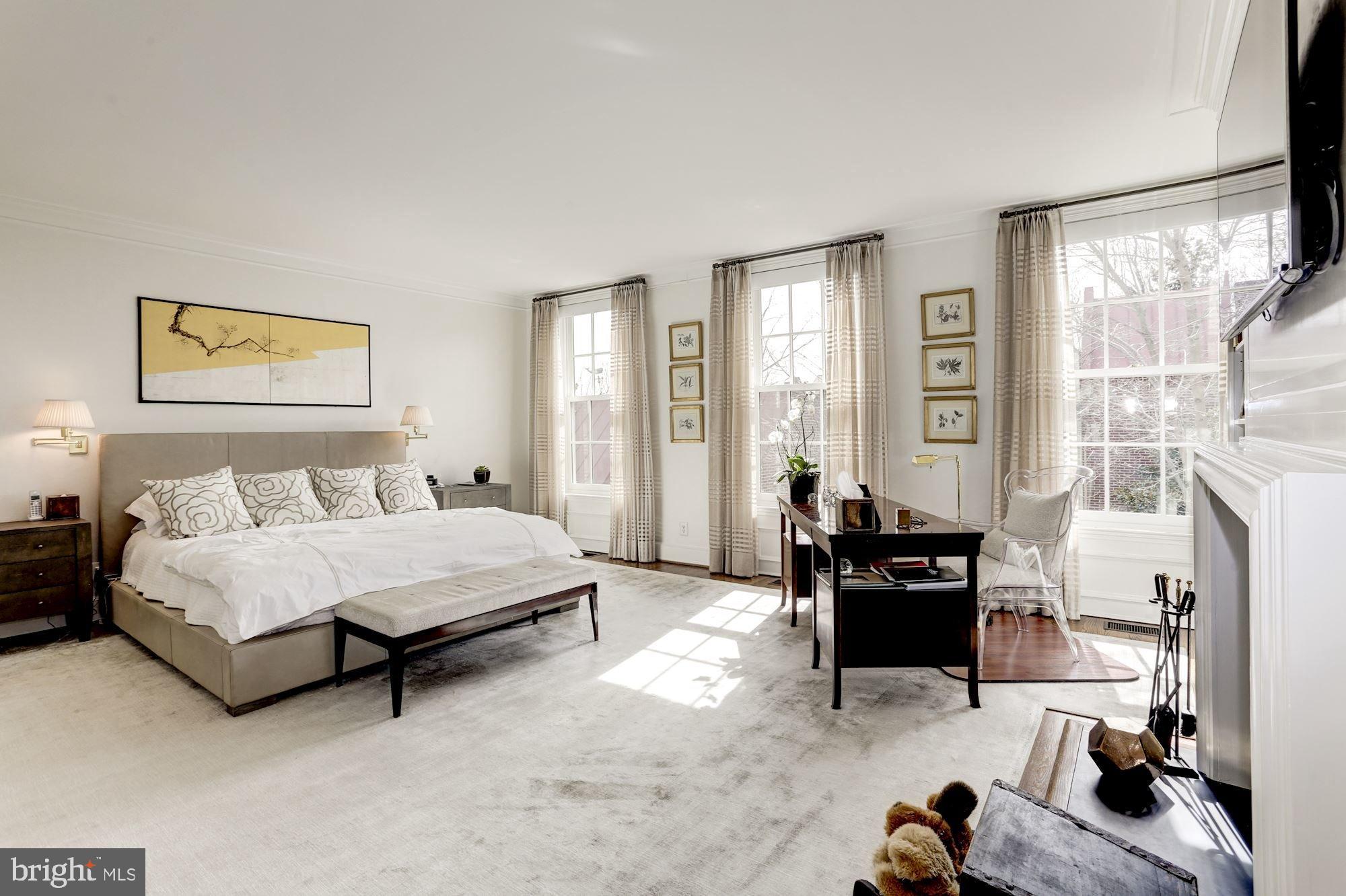 3224 Volta Place Northwest Washington, DC 20007 - Photo 20 of 35 a spacious bedroom with a bed and a couch