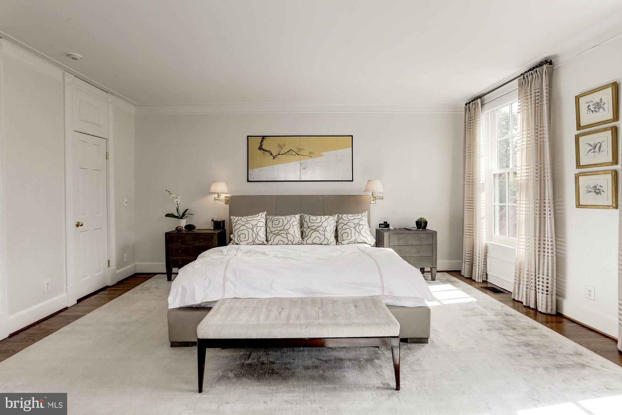 3224 Volta Place Northwest Washington, DC 20007 - Photo 22 of 35 a bedroom with a bed and a table in it