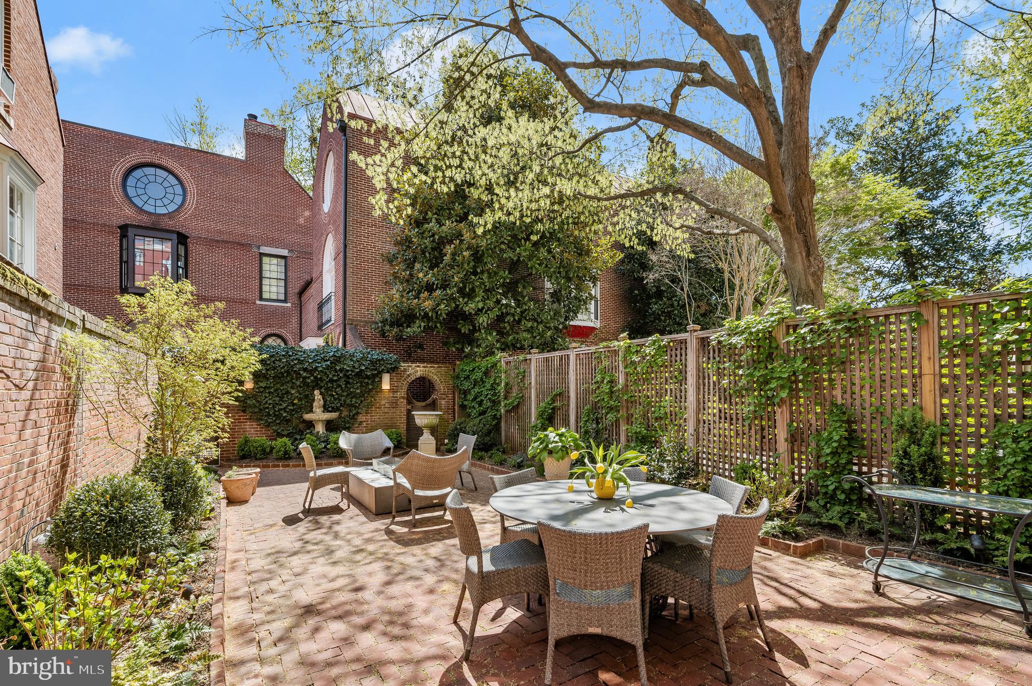 3224 Volta Place Northwest Washington, DC 20007 - Photo 32 of 35 a view of a patio with table and chairs and potted plants