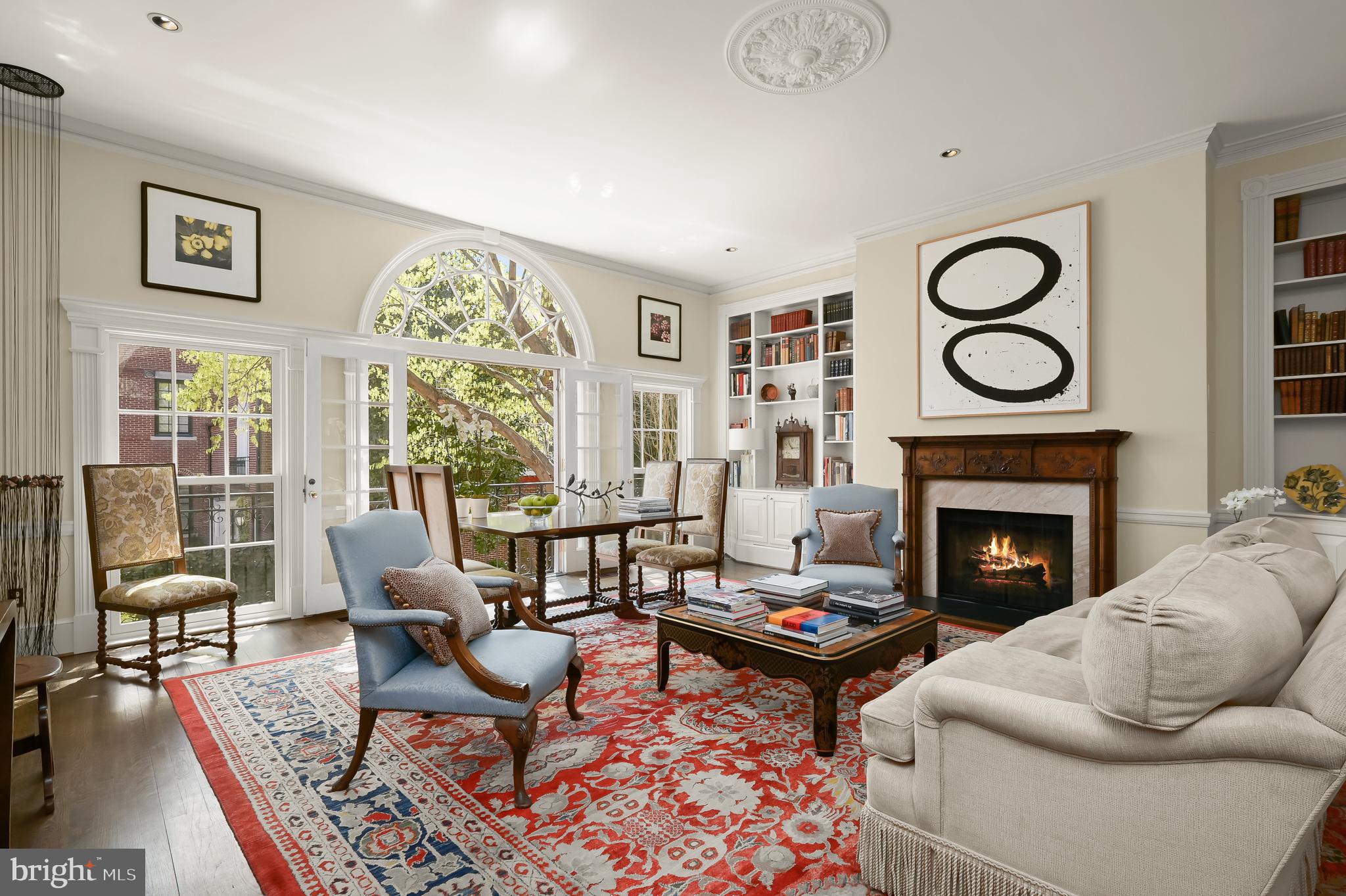 3224 Volta Place Northwest Washington, DC 20007 - Photo 5 of 35 a living room with furniture a rug and a fireplace