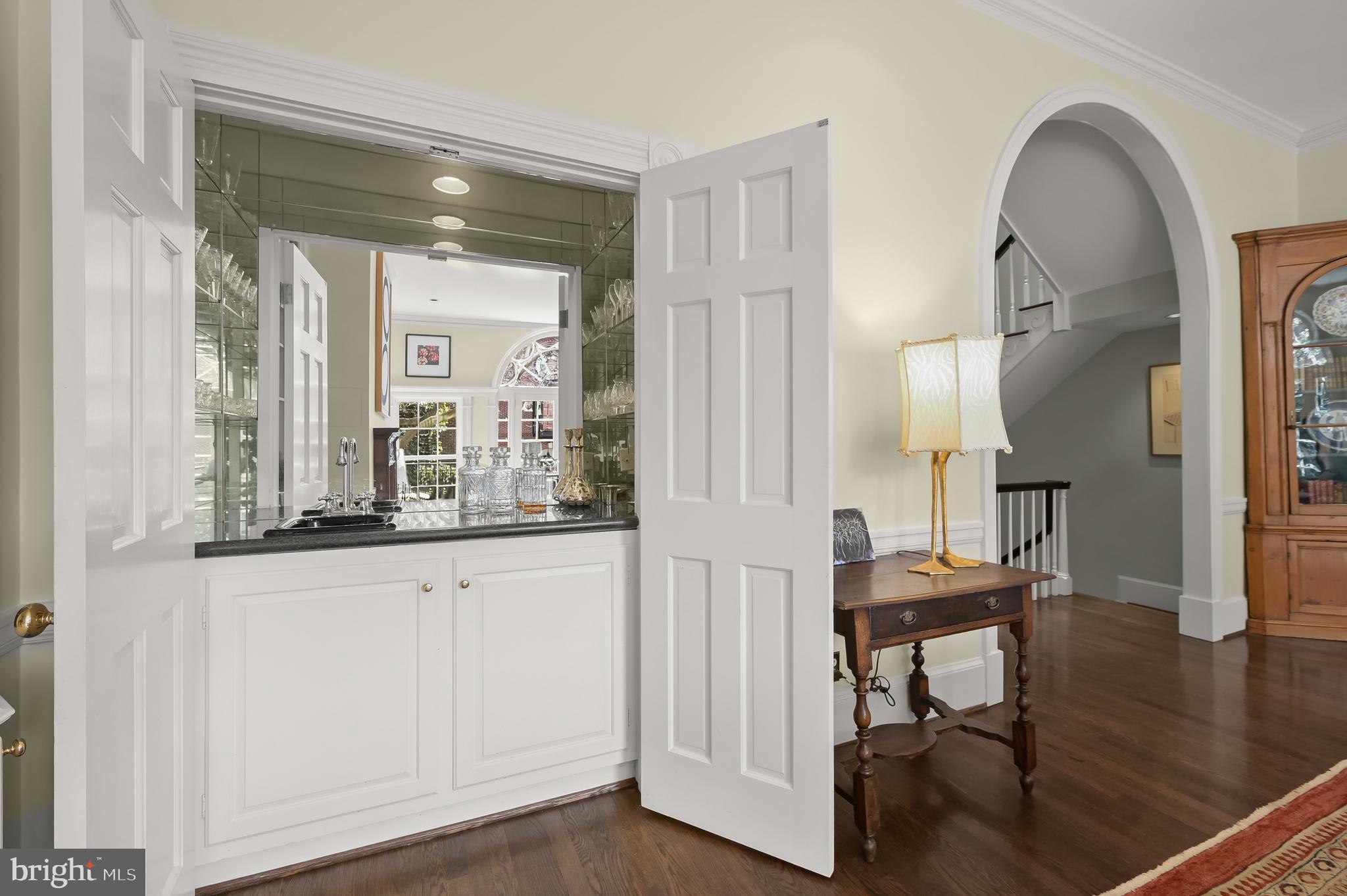 3224 Volta Place Northwest Washington, DC 20007 - Photo 9 of 35 a view of hall way with mirror and furniture