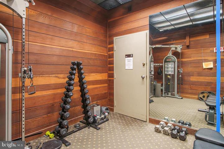 700 7th Street Southwest, Unit 432 Washington, DC 20024 - Photo 7 of 33 Home gym with warm wooden accents.