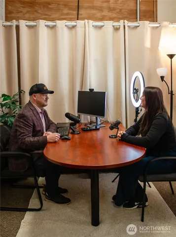 a view of a house with a door and wooden walls