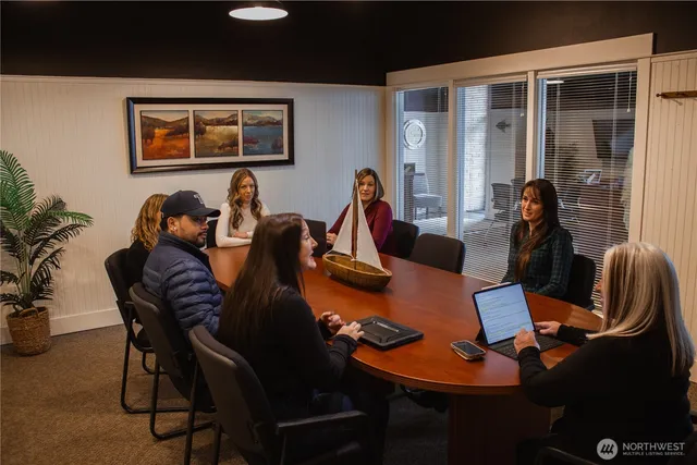 a dining room with furniture and wooden floor